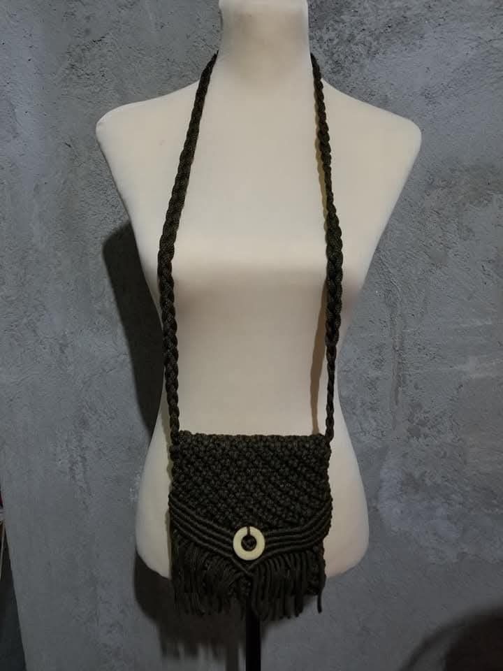 Handmade Macrame Crossbody Bag (Category: Cross-body Bags) located in Bulacan. Submitted by atticus26 (Listing ID 1437998139, Image 3). Description: - Handmade macrame crossbody bag - Woven design with flap closure - Available colors: black with red/yellow/green stripes, maroon, olive green, brown - Braided strap - Perfect for carrying essentials.