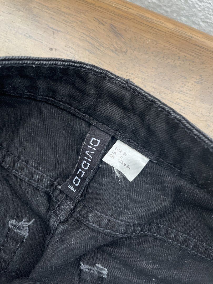 H&M Divided Black Denim Skirt (Category: Skirts) located in Manila. Submitted by decluttering.md21 (Listing ID 1437958170, Image 3). Description: - H&M Divided black denim skirt - Classic five-pocket design - Raw hem - Button and zipper closure - Size: EUR 36, US 4, CA 4, MX 4 - Made in Pakistan.