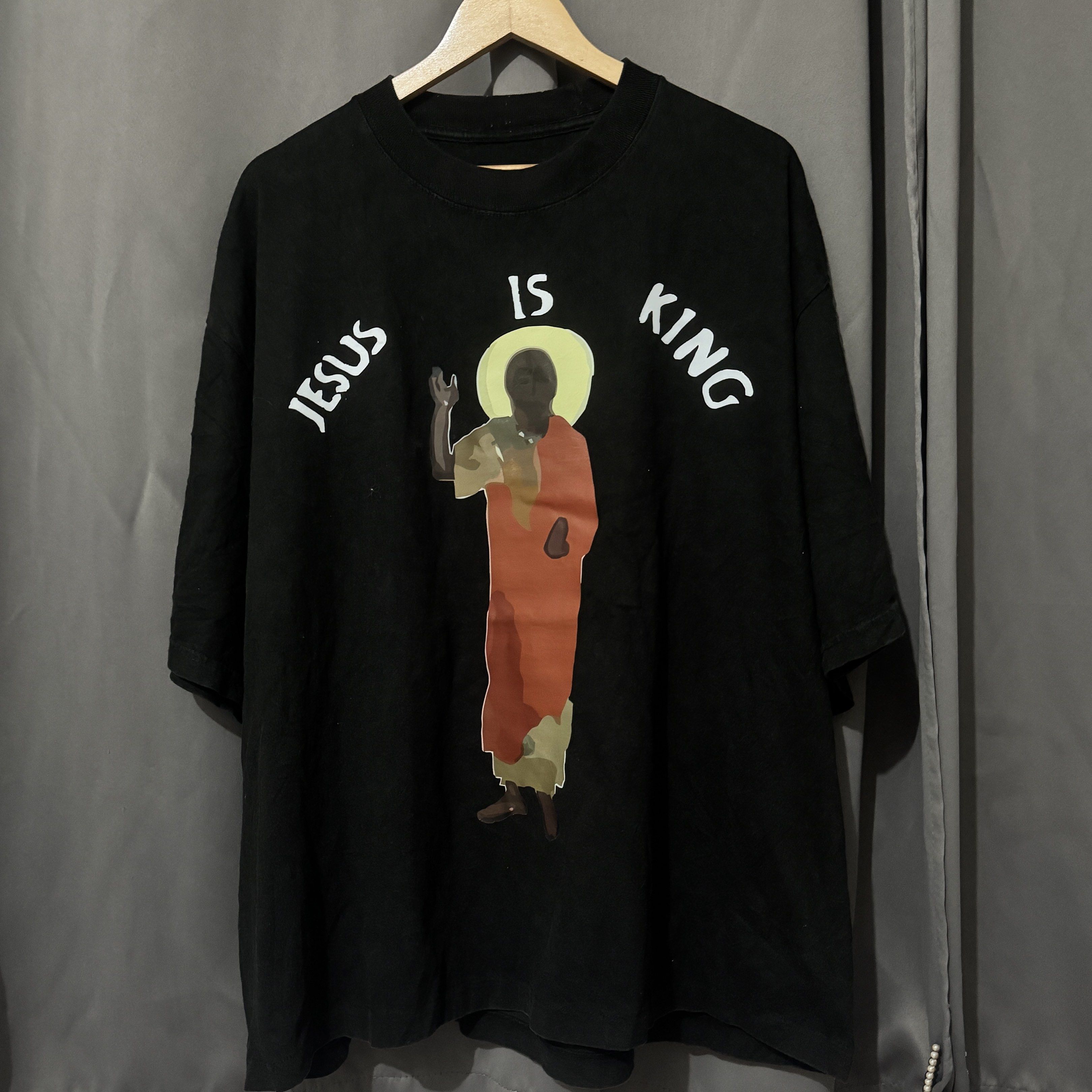 Jesus is King Black T-shirt (Category: Tshirts & Polo Shirts ) located in Caloocan City. Submitted by bilogi888_ (Listing ID 1438081269, Image 1). Description: - Black t-shirt - Features a "JESUS IS KING" graphic print - Crew neck design - Short sleeves - Available sizes: [Specify sizes here] - Perfect for everyday wear!.