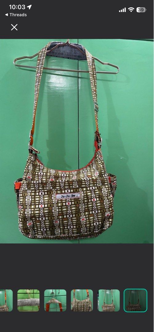 Jujube bag (Category: Diaper Bags & Wetbags) located in Quezon City. Submitted by OtheliaFinds (Listing ID 1438072140, Image 2). Description: This is the ultimate "everything" bag. While designed as baby or pedia visit bag. Its messenger silhouette makes it also perfect for students, commuters, or anyone who loves a high-functioning bag with a fun, vintage aesthetic. The magnetic closures on the front flap allow for silent, easy access. • Dimensi