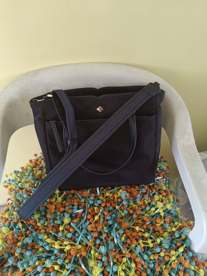 Kate Spade Nylon two way bag (Category: Luxury Bags & Wallets) located in Dasmarinas. Submitted by jliskenzo (Listing ID 1437965881, Image 3). Description: in good used condition seldom used no flaw authentic 9" height x 11" width adjustable sling top leather handle 5.5" approx.