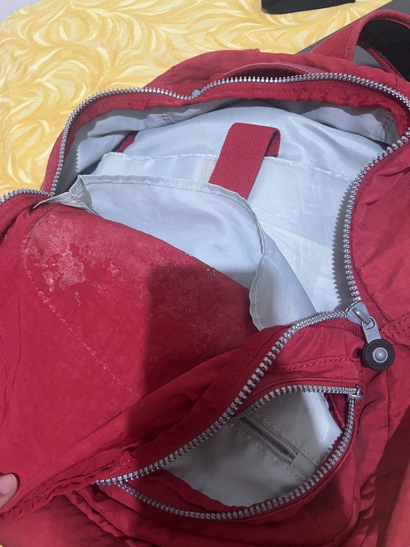 Kipling Seoul Cherry Red Backpack (Category: Backpacks) located in Arakan. Submitted by mangaroo (Listing ID 1418797228, Image 2). Description: - Red Kipling backpack - Multiple zippered compartments - Adjustable shoulder straps - Top handle - Kipling logo on front - Durable, water-resistant material - Buyer to pay for SF.