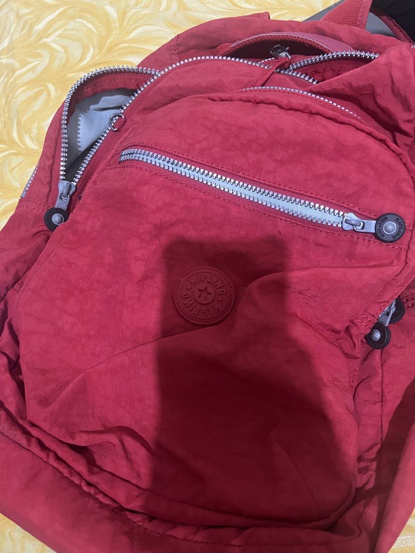 Kipling Seoul Cherry Red Backpack (Category: Backpacks) located in Arakan. Submitted by mangaroo (Listing ID 1418797228, Image 3). Description: - Red Kipling backpack - Multiple zippered compartments - Adjustable shoulder straps - Top handle - Kipling logo on front - Durable, water-resistant material - Buyer to pay for SF.