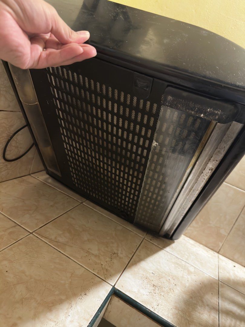 La Germania Range Hood (Category: Other Kitchen Appliances) located in Pasig City. Submitted by pochic1996 (Listing ID 1437942797, Image 3). Description: Black La Germania range hood. Features a vent and control buttons. Includes a power cord. The filter is visible. The unit has some dust and marks. All functions working. .