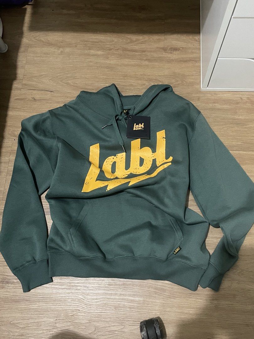 LABL Green Hoodie - Size M (Category: Hoodies) located in Paranaque City. Submitted by uuuuugn1hc.18181818 (Listing ID 1438041792, Image 1). Description: - Green LABL hoodie - Yellow logo - Size: M - Features: Hood with drawstrings, front pocket - Brand logo on lower front and tag - Print: 'Living a Balanced Life'.