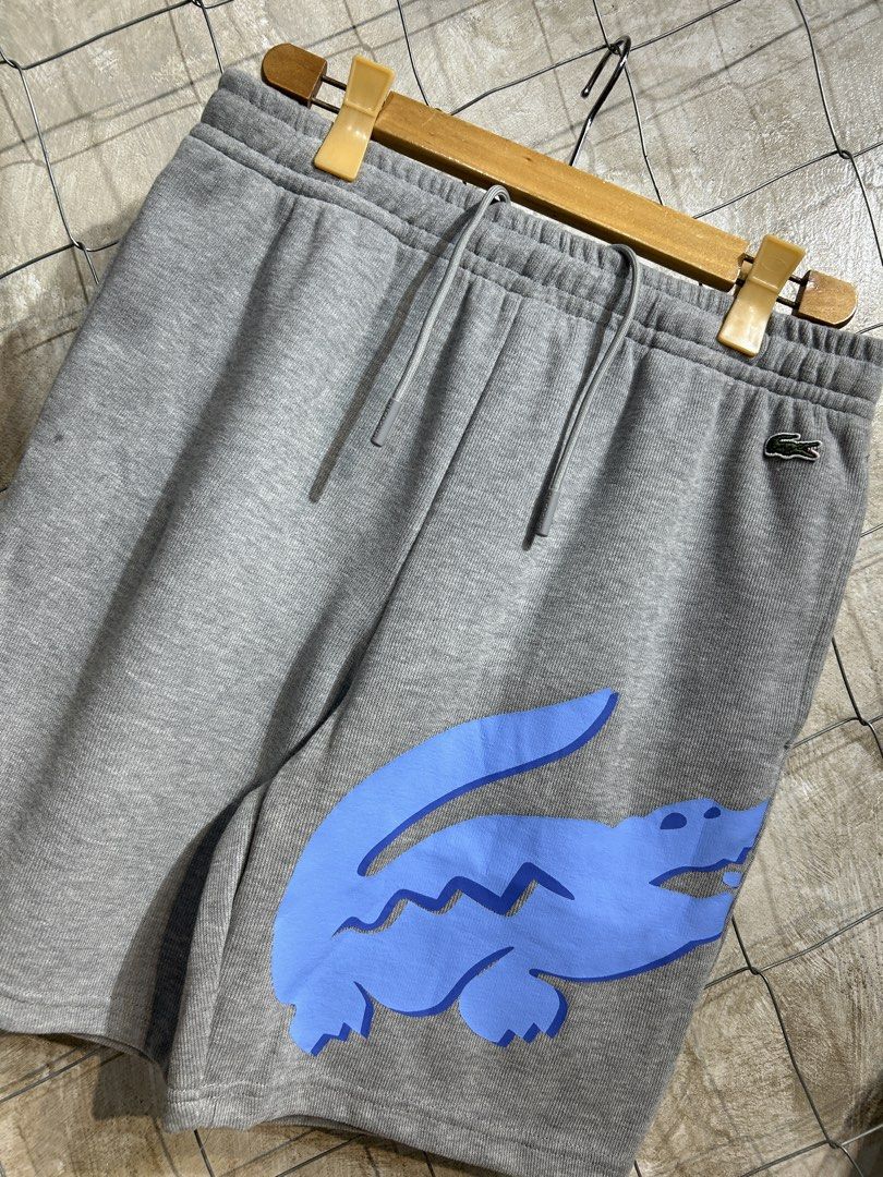 Lacoste Grey Shorts with Blue Crocodile (Category: Shorts) located in Manila. Submitted by ardobe.mnl (Listing ID 1438079286, Image 2). Description: Lacoste Bigcroc Gray Short. Size: L Waistline: 31-38 Length: 19" Condition: Good asnew Flaw: None! Dm for inquiries! 📥.
