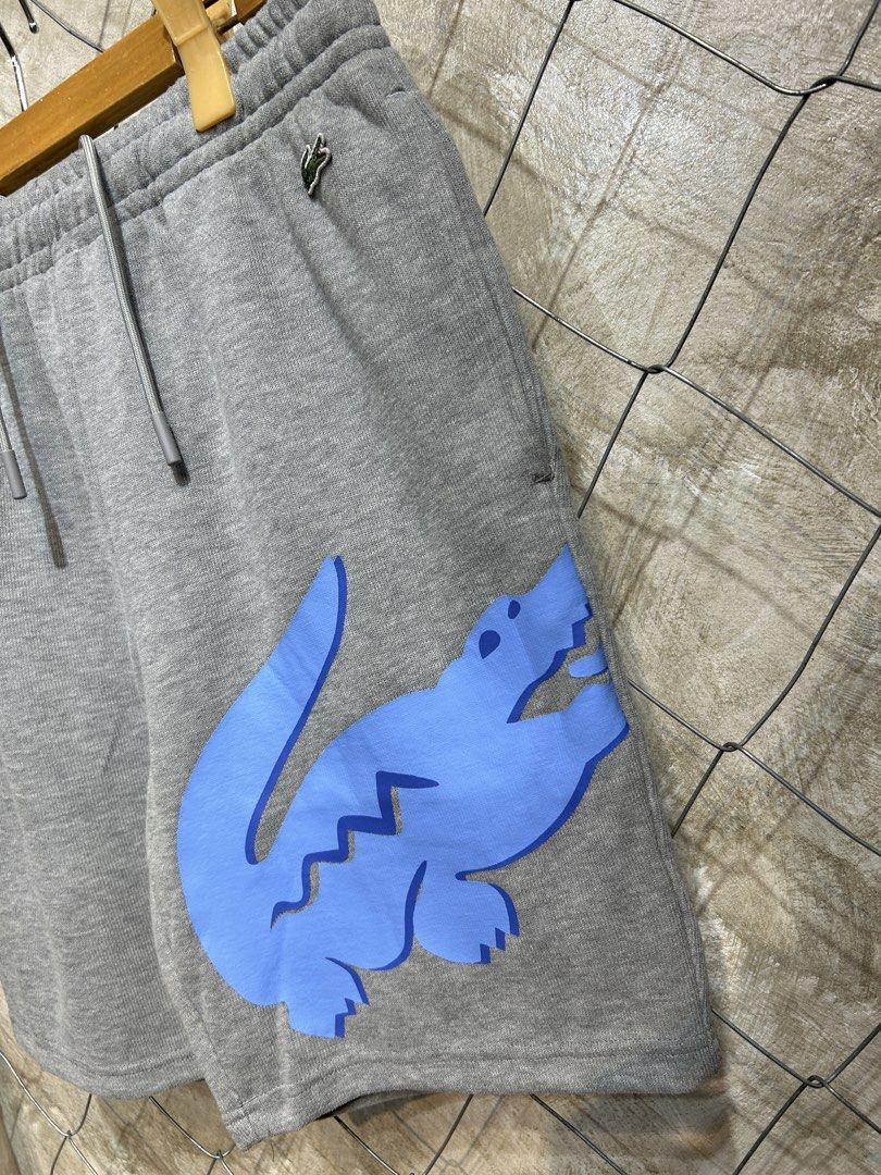 Lacoste Grey Shorts with Blue Crocodile (Category: Shorts) located in Manila. Submitted by ardobe.mnl (Listing ID 1438079286, Image 3). Description: Lacoste Bigcroc Gray Short. Size: L Waistline: 31-38 Length: 19" Condition: Good asnew Flaw: None! Dm for inquiries! 📥.