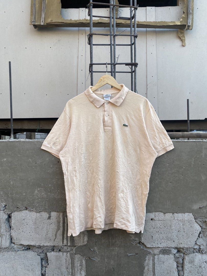 Lacoste Polo Shirt - Size 6 (Category: Tshirts & Polo Shirts ) located in Candaba. Submitted by dejesus.bench17 (Listing ID 1438078370, Image 1). Description: - Authentic Lacoste polo shirt - Light beige color - Size 6 - 100% cotton - Iconic crocodile logo - Made in Peru, designed in France - Classic polo collar with button closure - Timeless style -Excellent Condition -No issue -Dimes: W23 L28 -Need wash only -Price: 950 + ship.