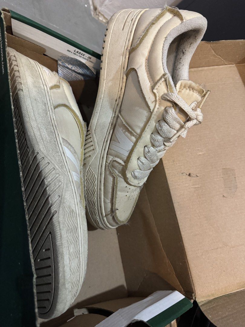 Lacoste cream casual shoes (Category: Sneakers) located in Calamba. Submitted by nanamatheo01 (Listing ID 1437967655, Image 1). Description: - Cream-colored lacoste sneakers - Size: EUR 38, UK 5, USA 7 - Textile upper - Includes original box - Lace-up closure Rfs: decluttering Loc: calamba laguna Issue: natambak na sya needs clean up. Nagcrack rin yung isang logo sa tongue nung shoes selling it low, pero intact naman. kayo na po palinis.
