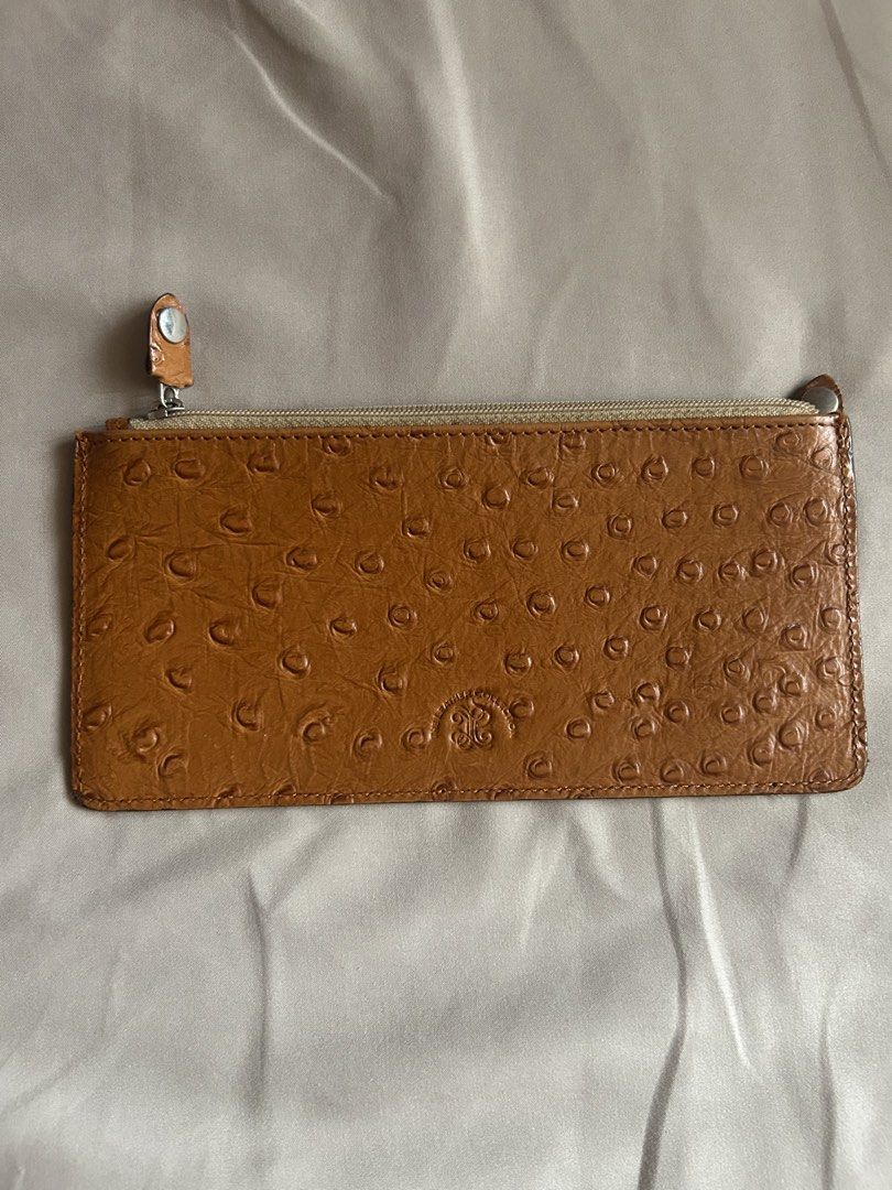 Leather Collection Ostrich Skin Wallet (Category: Wallets & Card holders) located in Quezon City. Submitted by onthehanger_ph (Listing ID 1437954337, Image 3). Description: Genuine ostrich skin leather wallet Features a zipper closure Spacious interior and a slim design Brown exterior, lighter interior .