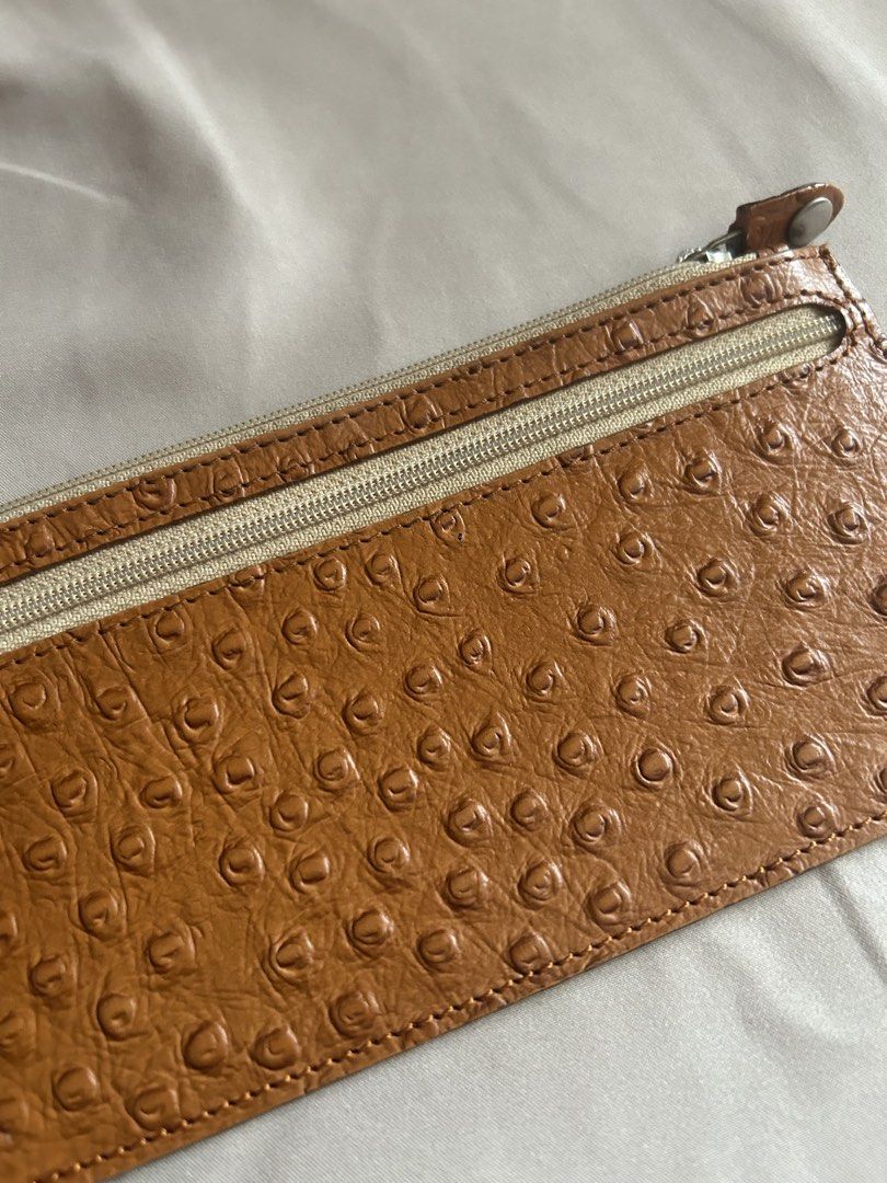 Leather Collection Ostrich Skin Wallet (Category: Wallets & Card holders) located in Quezon City. Submitted by onthehanger_ph (Listing ID 1437954337, Image 2). Description: Genuine ostrich skin leather wallet Features a zipper closure Spacious interior and a slim design Brown exterior, lighter interior .