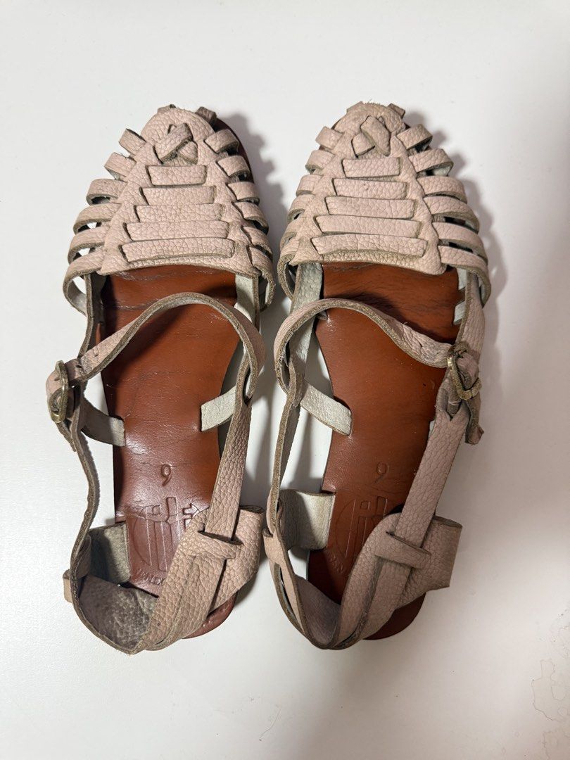 Leather Gladiator Sandals Size 9 (Category: Flats & Sandals) located in Dasmarinas. Submitted by niks.2nd (Listing ID 1438063834, Image 1). Description: - Gladiator sandals - Woven leather upper - Size 9 - Light pink straps - Brown footbed - Buckle closure - Perfect for casual wear.