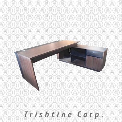 L-Shaped Office Desk TXT-074 (Category: Office Furniture & Fixtures) located in Caloocan City. Submitted by trishtine_jim9 (Listing ID 1437984973, Image 2). Description: - L-shaped office desk by Trishtine Corp. - Dark wood finish. - Modern design with clean lines. - Built-in cabinet and shelving for storage. - Includes a drawer. - Sturdy build. - Ideal for home or professional workspaces. - Provides ample workspace. DISCLAIMER: Price is for Post