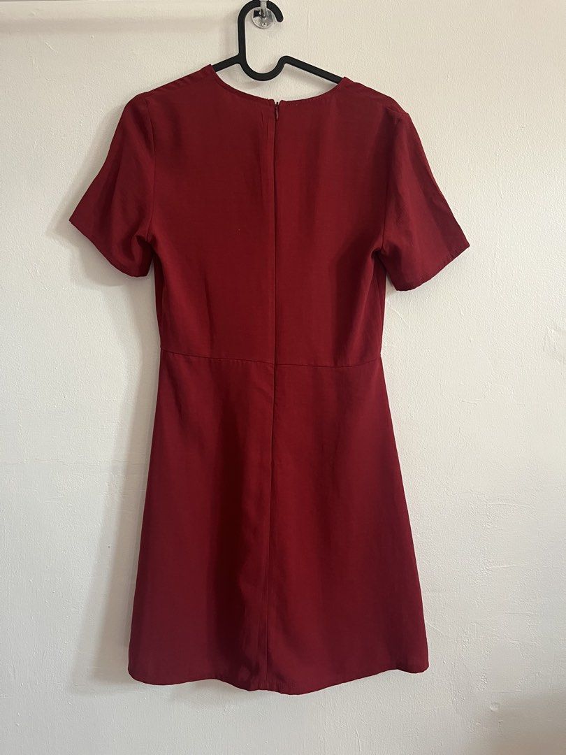 Mango Red Dress (Category: Dresses) located in Mandaluyong City. Submitted by declutterrie (Listing ID 1438073665, Image 3). Description: - Mango Casual wrap dress - Size: XS - Color: Red - Design: Wrap style with button details - Sleeves: Short - Closure: Back zipper - Fabric: Smooth.