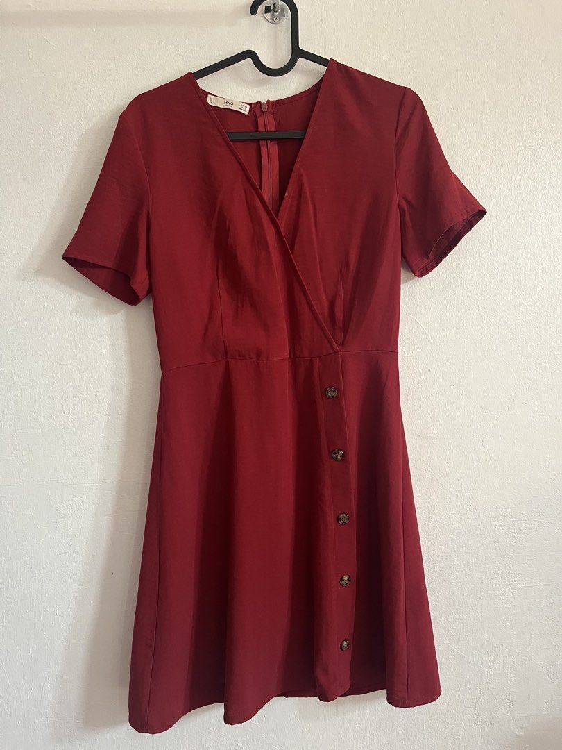 Mango Red Dress (Category: Dresses) located in Mandaluyong City. Submitted by declutterrie (Listing ID 1438073665, Image 2). Description: - Mango Casual wrap dress - Size: XS - Color: Red - Design: Wrap style with button details - Sleeves: Short - Closure: Back zipper - Fabric: Smooth.