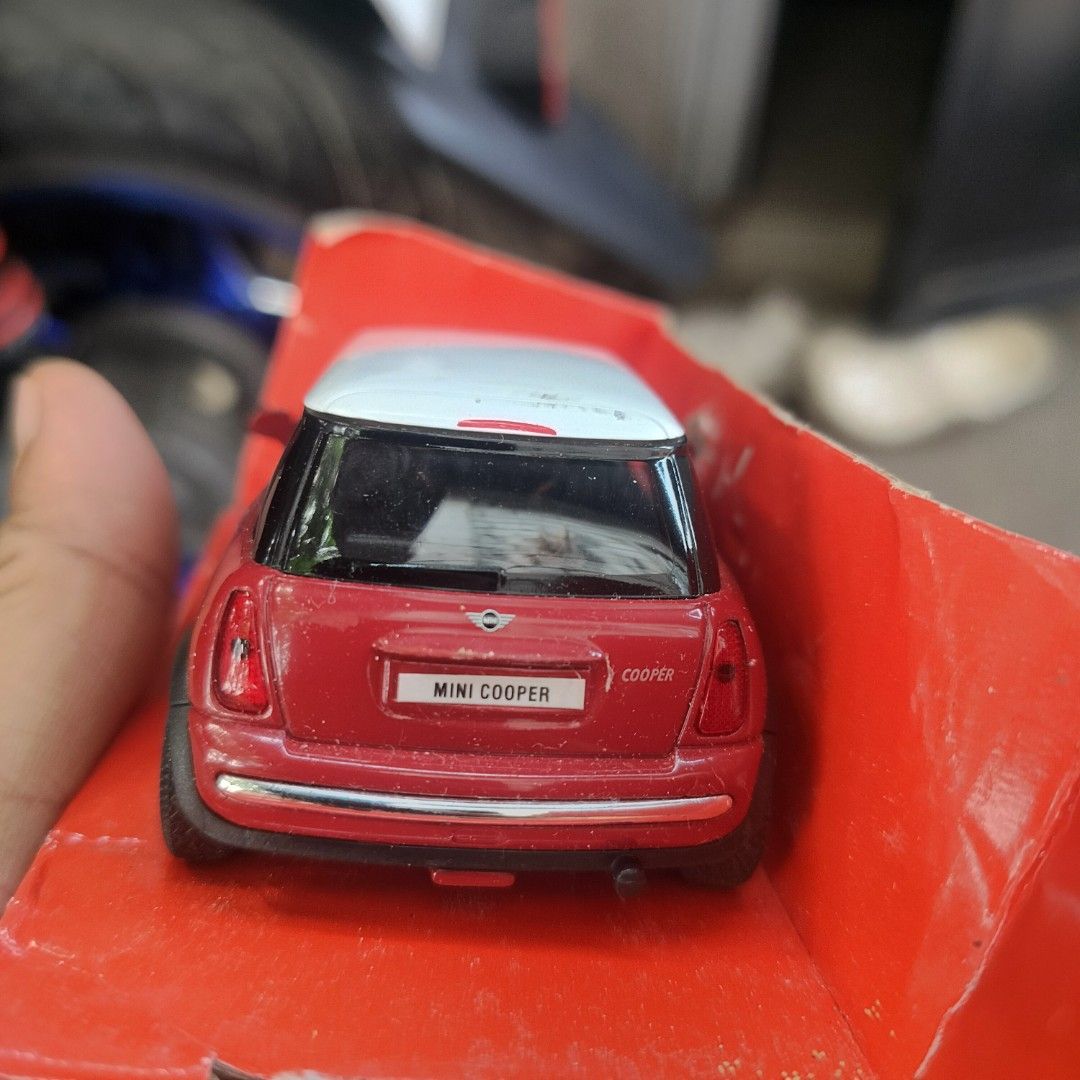 Mini Cooper Toy Car (Category: Vehicle & Diecast Models) located in Plaridel. Submitted by klayskolektibols (Listing ID 1438002930, Image 2). Description: - Red Mini Cooper toy car - White roof - Original packaging - Black wheels with silver rims - Mini Cooper logo on the back - "Cooper" on the license plate.