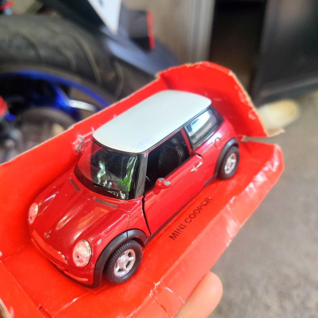 Mini Cooper Toy Car (Category: Vehicle & Diecast Models) located in Plaridel. Submitted by klayskolektibols (Listing ID 1438002930, Image 3). Description: - Red Mini Cooper toy car - White roof - Original packaging - Black wheels with silver rims - Mini Cooper logo on the back - "Cooper" on the license plate.