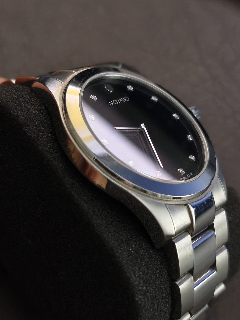 Mint Movado Junior Sport Black Dial (Category: Luxury Watches) located in Tarlac. Submitted by irishign0593824 (Listing ID 1437941303, Image 3). Description: Brand: Movado Swiss Watch only! Key Features:Case: 38.5 mm stainless steel with a scratch-resistant sapphire crystal.Movement: Swiss quartz.Dial: Black with 12 diamond markers and the iconic silver-tone Movado dot at 12 o'clock.Water Resistance: Typically rated up to 30 meters..