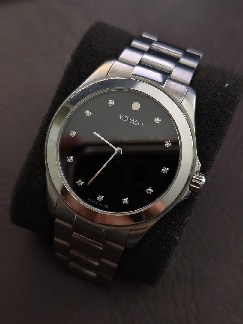 Mint Movado Junior Sport Black Dial (Category: Luxury Watches) located in Tarlac. Submitted by irishign0593824 (Listing ID 1437941303, Image 2). Description: Brand: Movado Swiss Watch only! Key Features:Case: 38.5 mm stainless steel with a scratch-resistant sapphire crystal.Movement: Swiss quartz.Dial: Black with 12 diamond markers and the iconic silver-tone Movado dot at 12 o'clock.Water Resistance: Typically rated up to 30 meters..