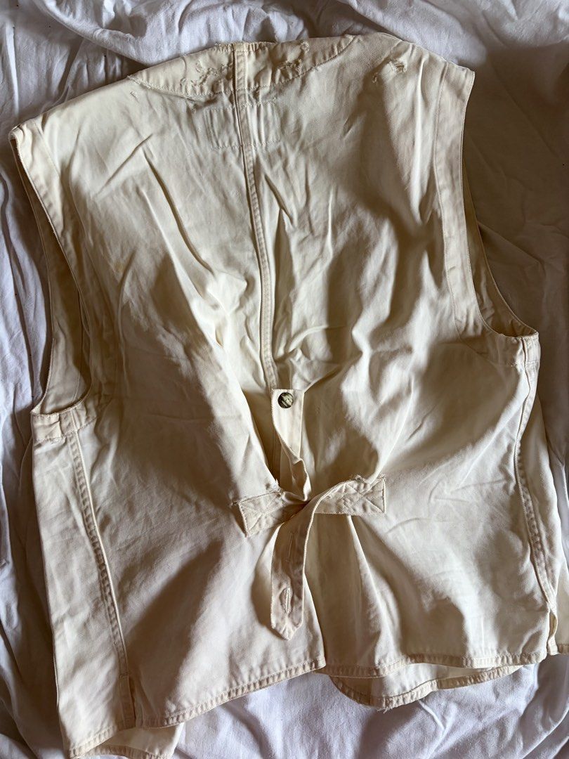 NASTRA Men's Vest (Category: Vests) located in Manila. Submitted by andreacap (Listing ID 1437966565, Image 3). Description: - Cream-colored vest from NASTRA - Multiple pockets - Button closures - Tie-back detail for adjustable fit - From the Men's Wear collection (est. 1981) - Minor wear and tear around the collar - Visible Stains 🎀 currently decluttering/selling pre-loved clothes, check my page for more details! 🎀 please manage expectations, 