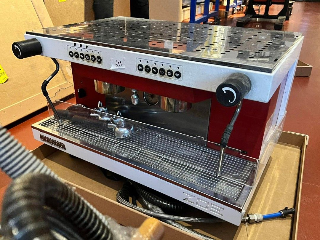New Arrival! Sanremo ZOE Espresso Machine (Category: Coffee Machines & Makers) located in Manila. Submitted by coffeemachineexpert (Listing ID 1437987140, Image 1). Description: - Sanremo ZOE espresso machine - Stylish red and white color scheme - Features a steam wand for frothing milk - Includes a portafilter and drip tray - Stainless steel top with a grid pattern - Brand: Sanremo - Model: ZOE.