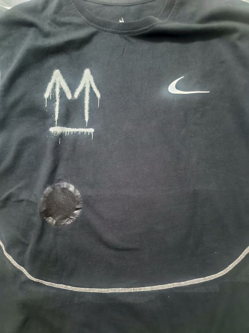 Nike Off-White T-Shirt (Category: Tshirts & Polo Shirts ) located in Las Pinas. Submitted by live_marticko (Listing ID 1438063143, Image 3). Description: - Black Nike Off-White T-shirt ✅Size: M on tag (Best fit L to semiXL) ✅Color: Black ✅Dimension: Width: 23" Length: 28" ✅Colorate: 9.6/10 - White stitching details - Features Nike logo and Off-White graphics - Includes size and care label - Unique curved hemline - Spray-painted arrow design.