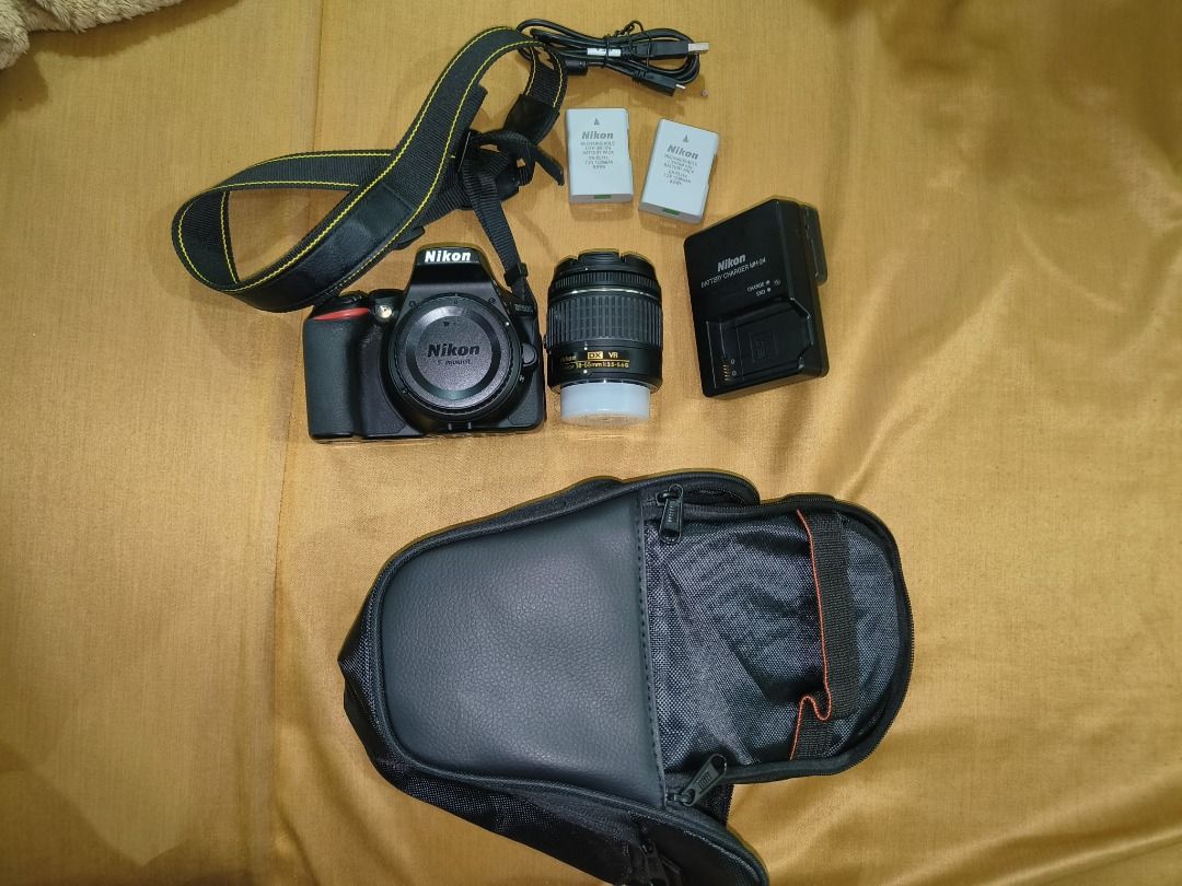 Nikon D5600 DSLR Camera (Category: Cameras) located in Calamba. Submitted by buy-play-sell-repeatx (Listing ID 1437966850, Image 1). Description: - Nikon D5600 DSLR camera - Includes 18-55mm kitlens lens with cap (needs cleaning) - Two orig batteries - Charger - Camera bag - Neck strap - Shutter count: 10k - No memory card included Honest issue, may mark ng tripod sa ilalim and the body is in need of cleaning. .