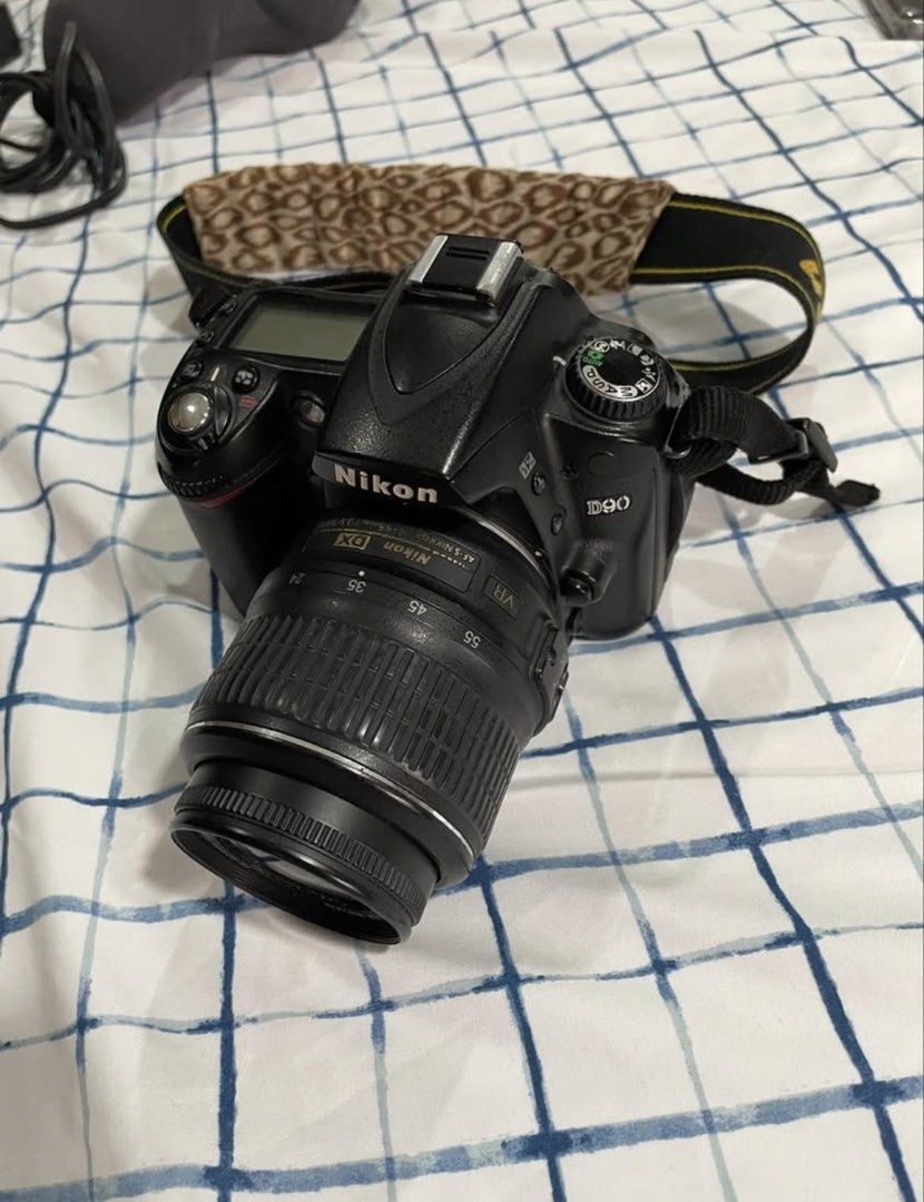 Nikon D90 DSLR Camera with Lenses and Accessories (Category: Cameras) located in Manila. Submitted by kyleramooos (Listing ID 1437990890, Image 1). Description: - Nikon D90 DSLR camera body - Lenses: kit lens, 50mm and 28-200mm - Accessories: - Charger - Battery - Camera bag - Flash diffuser - Camera strap - Good working condition.
