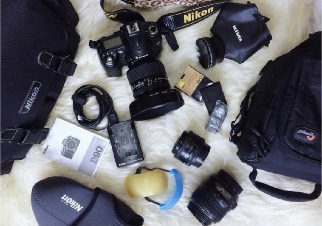 Nikon D90 DSLR Camera with Lenses and Accessories (Category: Cameras) located in Manila. Submitted by kyleramooos (Listing ID 1437990890, Image 2). Description: - Nikon D90 DSLR camera body - Lenses: kit lens, 50mm and 28-200mm - Accessories: - Charger - Battery - Camera bag - Flash diffuser - Camera strap - Good working condition.
