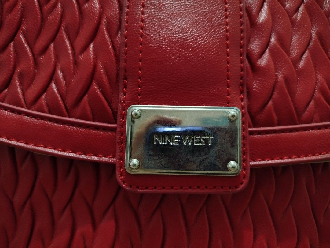 Nine West Red Textured Leather Tote Bag (Category: Shoulder Bags) located in Cavite. Submitted by prncs.jc (Listing ID 1438003128, Image 2). Description: Product Description: - Item: Nine West Red Textured Leather Tote Bag - Color: Vibrant Red - Material: Genuine Leather - Closure: Magnetic snap button closure with an internal tab - Handle/Strap: Dual leather shoulder straps with silver-tone hardware Interior: - Beige fabric lining - One internal