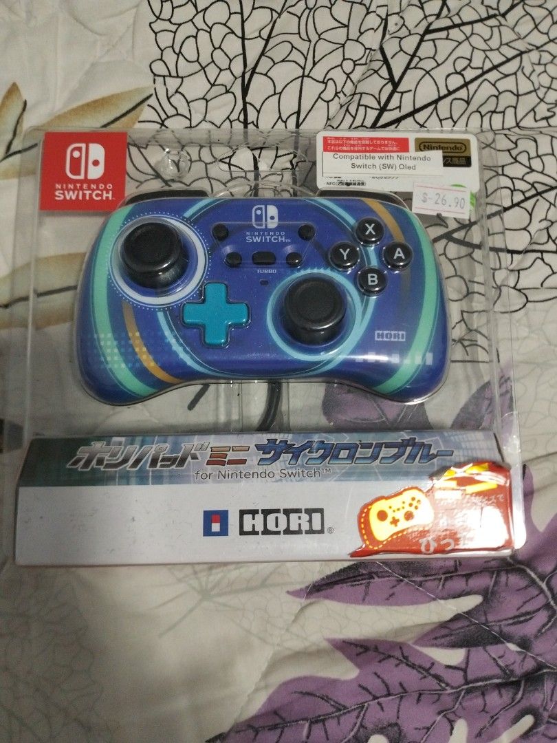 Nintendo switch wired controller (Category: Controllers) located in Singapore. Submitted by youngcatz (Listing ID 1438077796, Image 1). Description: - Brand new Nintendo Switch wired controller - Hori brand - Eye-catching blue design - Still in original packaging - unopened and self collect at postal code 200637.