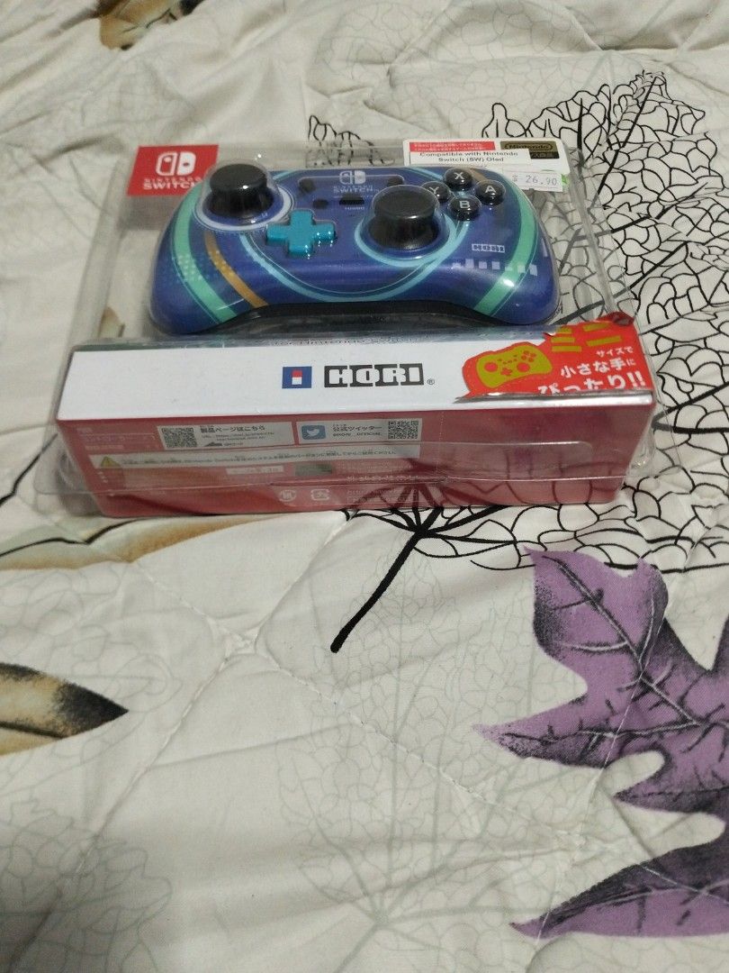 Nintendo switch wired controller (Category: Controllers) located in Singapore. Submitted by youngcatz (Listing ID 1438077796, Image 3). Description: - Brand new Nintendo Switch wired controller - Hori brand - Eye-catching blue design - Still in original packaging - unopened and self collect at postal code 200637.