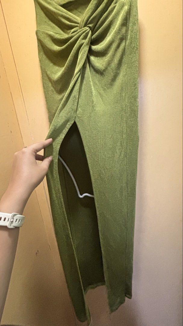 Olive Green Knot Front Slit Dress (Category: Dresses) located in Dasmarinas. Submitted by domilleee__ (Listing ID 1437984534, Image 2). Description: - Olive green dress - Knot front design - High slit - Textured fabric - Long, straight silhouette - Muted, earthy green color.