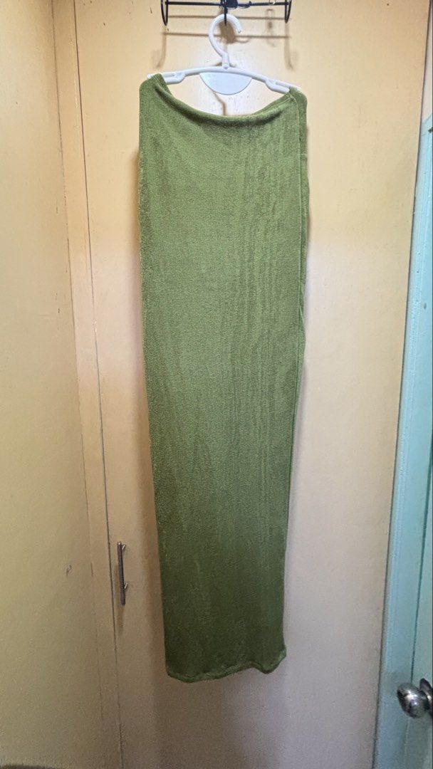 Olive Green Knot Front Slit Dress (Category: Dresses) located in Dasmarinas. Submitted by domilleee__ (Listing ID 1437984534, Image 3). Description: - Olive green dress - Knot front design - High slit - Textured fabric - Long, straight silhouette - Muted, earthy green color.