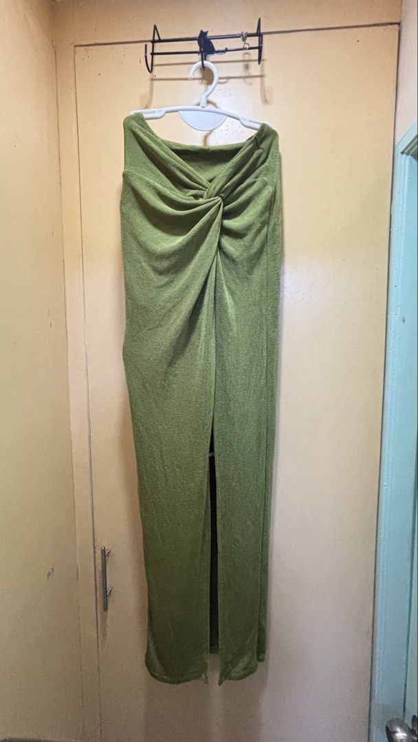 Olive Green Knot Front Slit Dress (Category: Dresses) located in Dasmarinas. Submitted by domilleee__ (Listing ID 1437984534, Image 1). Description: - Olive green dress - Knot front design - High slit - Textured fabric - Long, straight silhouette - Muted, earthy green color.