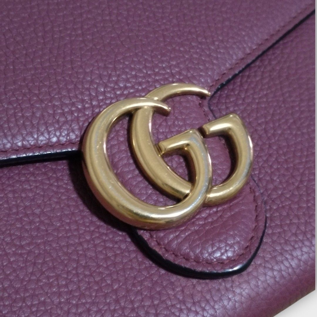 Original Gucci Marmont Chain Wallet (WOC) (Category: Luxury Bags & Wallets) located in San Juan City. Submitted by exclusivelyours (Listing ID 1438003774, Image 2). Description: This Gucci Marmont Chain Wallet (WOC) is a sophisticated, multi-functional accessory that bridges the gap between a large continental wallet and a compact crossbody bag. This particular version is crafted in a rich, berry-toned purple leather (often referred to as Prune o