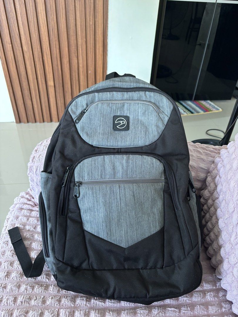 Original Hawk Backpack - Gray and Black (Category: Backpacks) located in Calauan. Submitted by amaris.boutique.ph (Listing ID 1437968794, Image 1). Description: - Hawk backpack in gray and black - Multiple zippered compartments - Side pockets - Adjustable shoulder straps - Padded back panel - Top handle - Perfect for school, work, or travel.