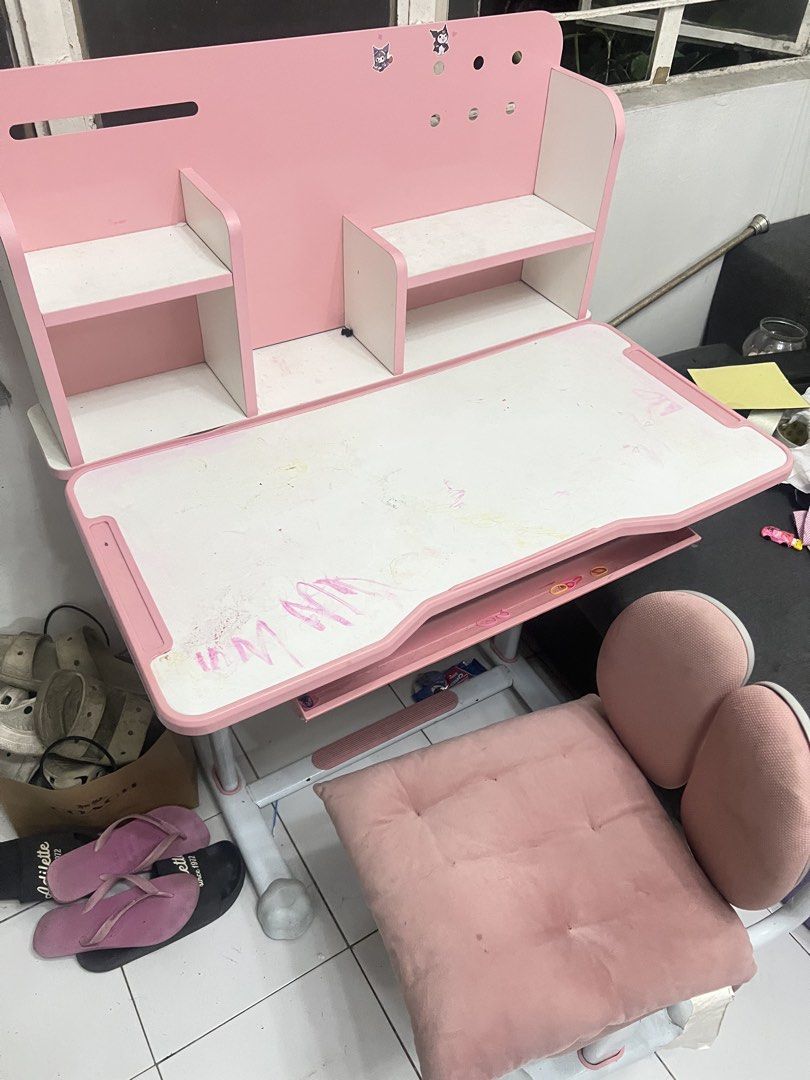 Pink Kids Study Desk and Chair Set (Category: Tables & Sets) located in Valenzuela. Submitted by jannvsantos (Listing ID 1438065681, Image 2). Description: - Pink and white kids' study desk and chair set. - Desk features a built-in shelf and pull-out drawer. - Chair has a unique backrest design. - Both desk and chair have adjustable height. - Perfect for children!.