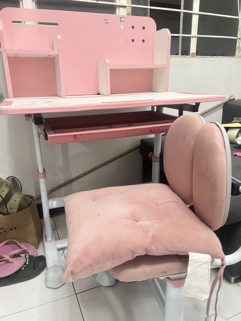 Pink Kids Study Desk and Chair Set (Category: Tables & Sets) located in Valenzuela. Submitted by jannvsantos (Listing ID 1438065681, Image 3). Description: - Pink and white kids' study desk and chair set. - Desk features a built-in shelf and pull-out drawer. - Chair has a unique backrest design. - Both desk and chair have adjustable height. - Perfect for children!.