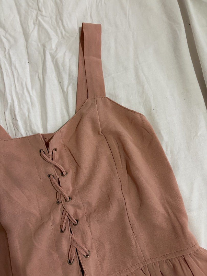 Pink Lace-Up Cami Top (Category: Sleeveless) located in Manila. Submitted by andreacap (Listing ID 1437963816, Image 2). Description: - Pink cami top - Lace-up front detail - Ruffled hem - Wide straps - Smocked back for comfort - Stylish and versatile 🎀 currently decluttering/selling pre-loved clothes, check my page for more details! 🎀 please manage expectations, you may send me a dm for more photos 🎀 my tops and bottoms fits xs-m 🎀 height: 5