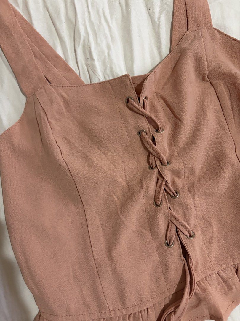 Pink Lace-Up Cami Top (Category: Sleeveless) located in Manila. Submitted by andreacap (Listing ID 1437963816, Image 3). Description: - Pink cami top - Lace-up front detail - Ruffled hem - Wide straps - Smocked back for comfort - Stylish and versatile 🎀 currently decluttering/selling pre-loved clothes, check my page for more details! 🎀 please manage expectations, you may send me a dm for more photos 🎀 my tops and bottoms fits xs-m 🎀 height: 5