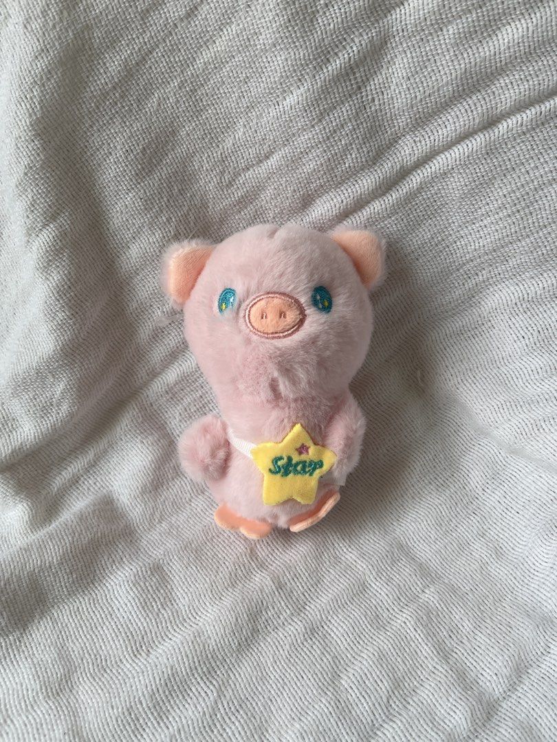 Pink Pig Plush Toy with Star (Category: Plushies & Soft Toys) located in Manila. Submitted by prima_onda (Listing ID 1437986506, Image 1). Description: - Adorable pink pig plush toy - Features a yellow star with "Star" on it - Has cute blue eyes and small ears - Made of soft, plush material - Perfect for collectors or gifts.