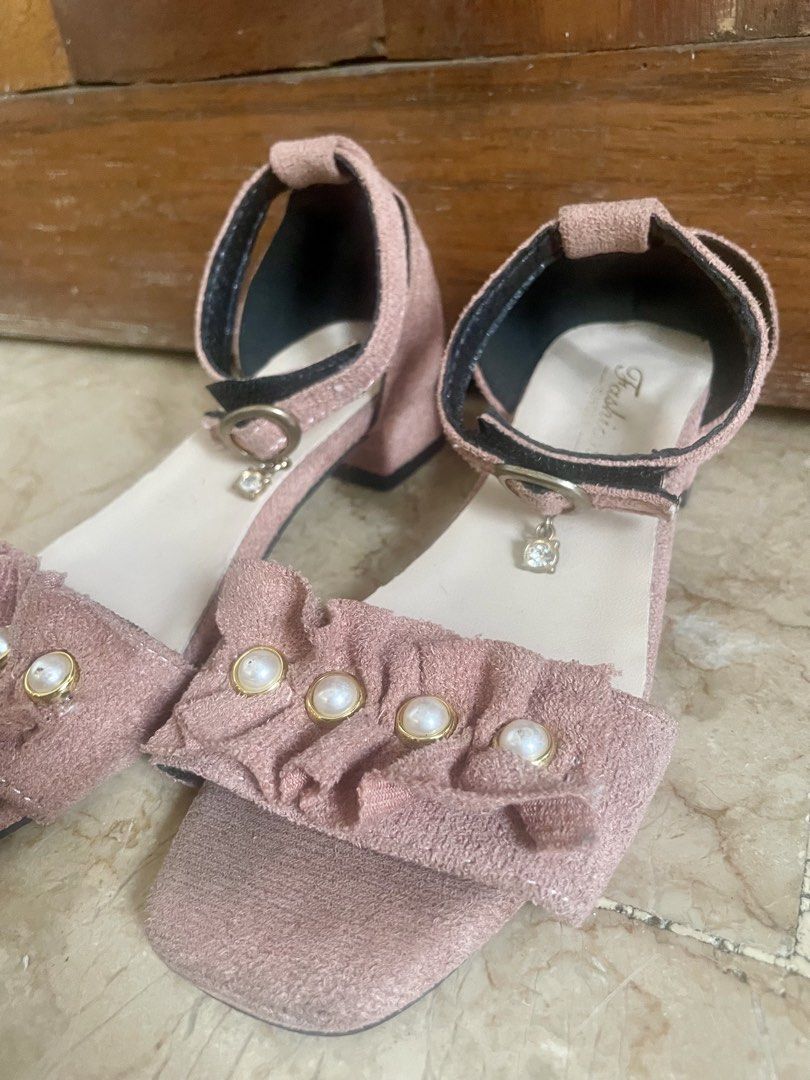 Pink Suede Ruffled Strap Sandals for Kids (Category: Flats & Sandals) located in Quezon City. Submitted by mixeditemsforsale (Listing ID 1438095599, Image 2). Description: - Pink sandals - Ruffled strap design with pearl accents - Block heel - Ankle strap with buckle closure - Size 31 - Adds elegance to any outfit.