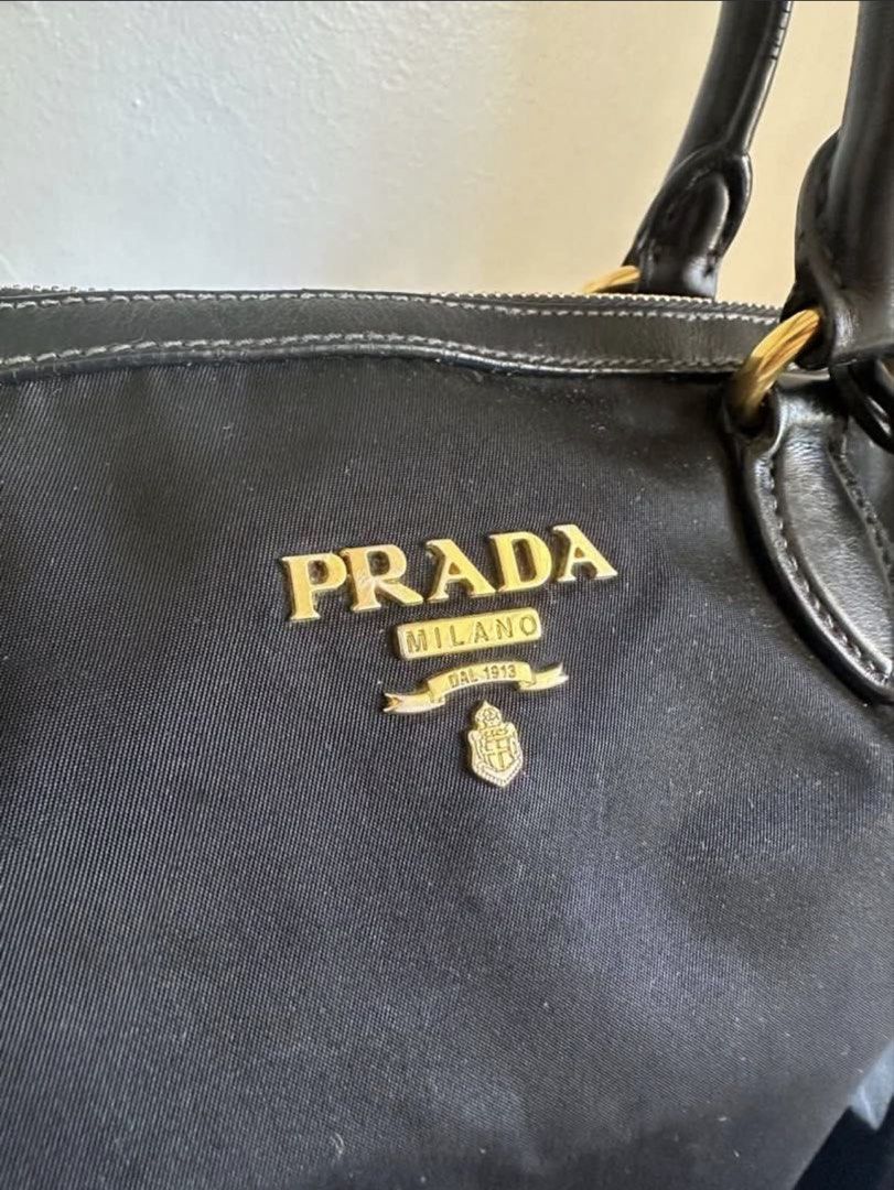 Prada Tessuto Soft CA Nero Handbag (Category: Luxury Bags & Wallets) located in Cabuyao City. Submitted by HelloSunshineDeclutters (Listing ID 1437994753, Image 2). Description: - Authentic Prada handbag - Black Tessuto fabric - Gold-tone hardware - Detachable shoulder strap Prada 1BA104 Color: Nero In good used condition, scratchmarks on the hardware Few cracks on the handle Needs a little cleaning, still very nice when worn/carried Interior is 
