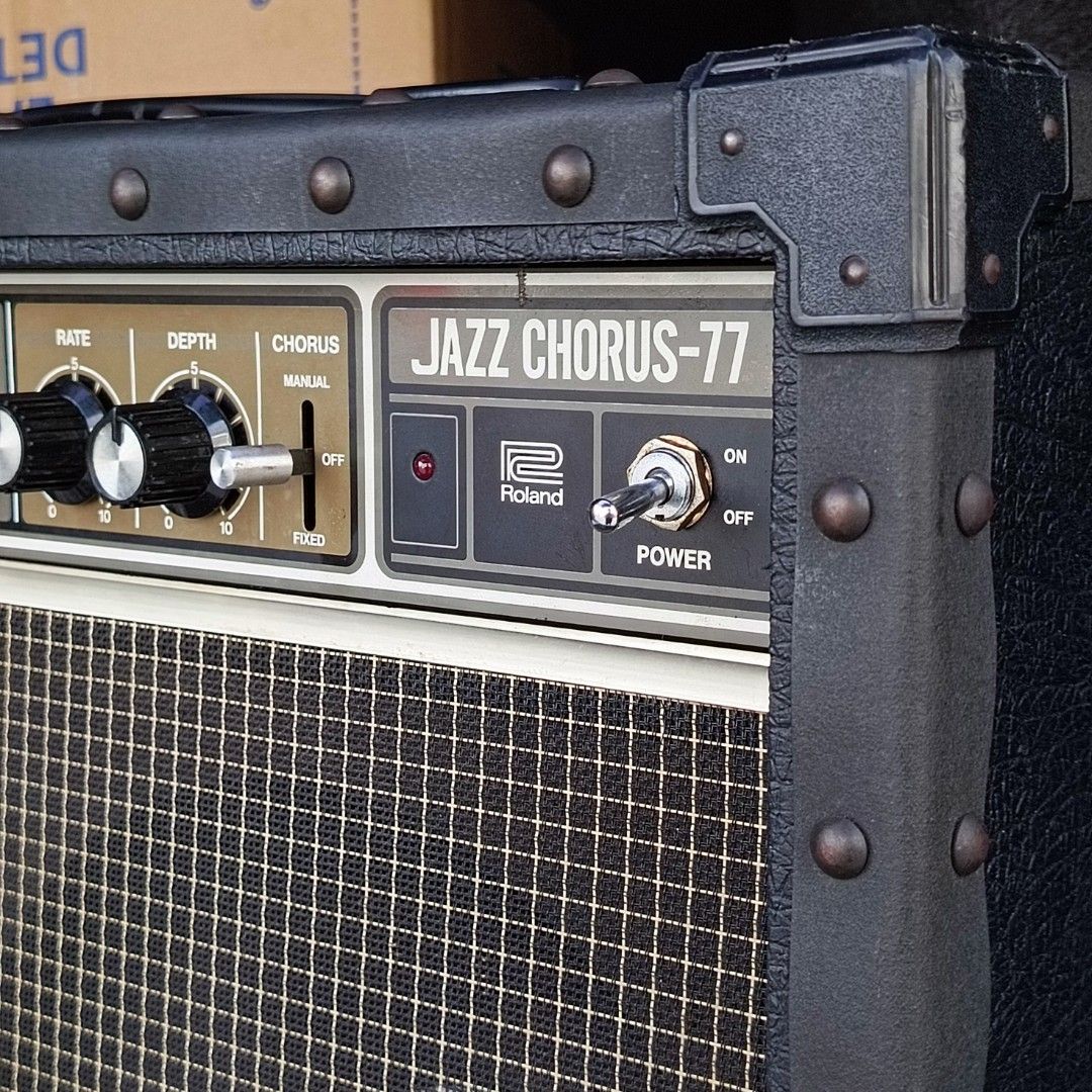 Roland Jazz Chorus-77 Guitar Amplifier (Category: Musical Instruments) located in Bulacan. Submitted by mykillseijin (Listing ID 1438078414, Image 1). Description: fs/ft - Roland Jazz Chorus-77 guitar amplifier - Classic black design - Metal corner protectors - Controls: Volume, Chorus, Rate, Depth - Power switch included - Features the Roland logo - Mounted on wheels for easy transport.