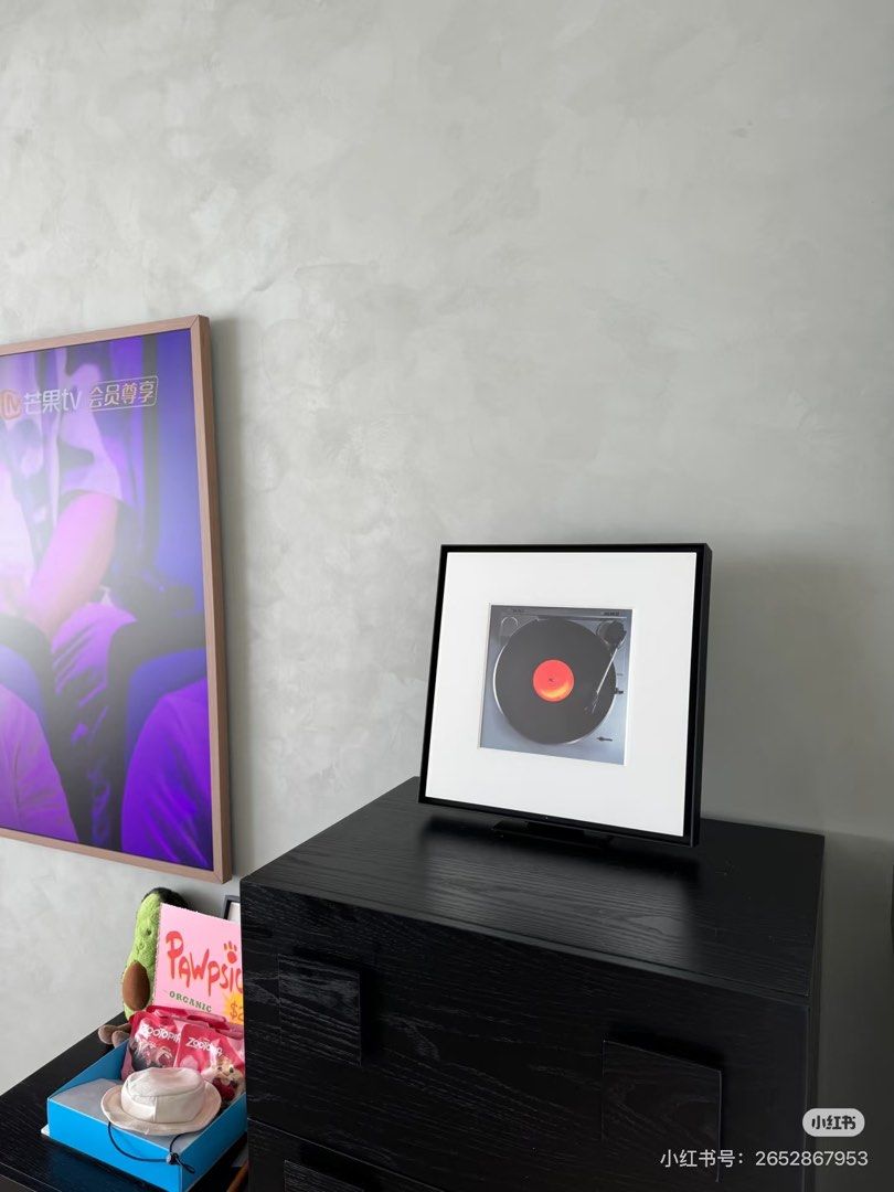 Samsung music frame (Category: Other Audio Equipment) located in Singapore. Submitted by chic_studio (Listing ID 1438072692, Image 3). Description: - Stylish framed art piece - Features a turntable design - Black frame with white matting - Perfect for vintage decor - Dimensions in images.