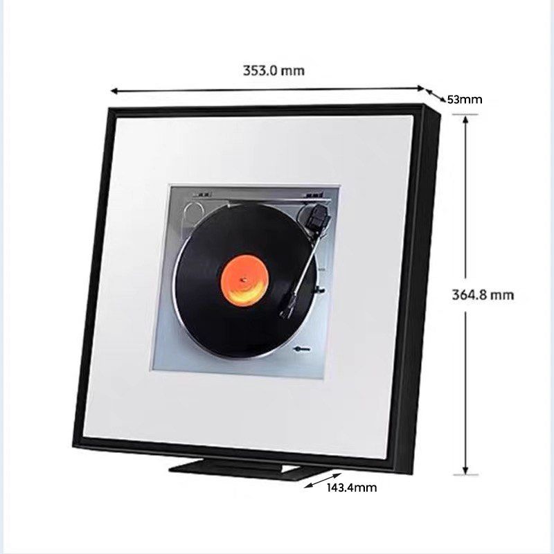 Samsung music frame (Category: Other Audio Equipment) located in Singapore. Submitted by chic_studio (Listing ID 1438072692, Image 1). Description: - Stylish framed art piece - Features a turntable design - Black frame with white matting - Perfect for vintage decor - Dimensions in images.