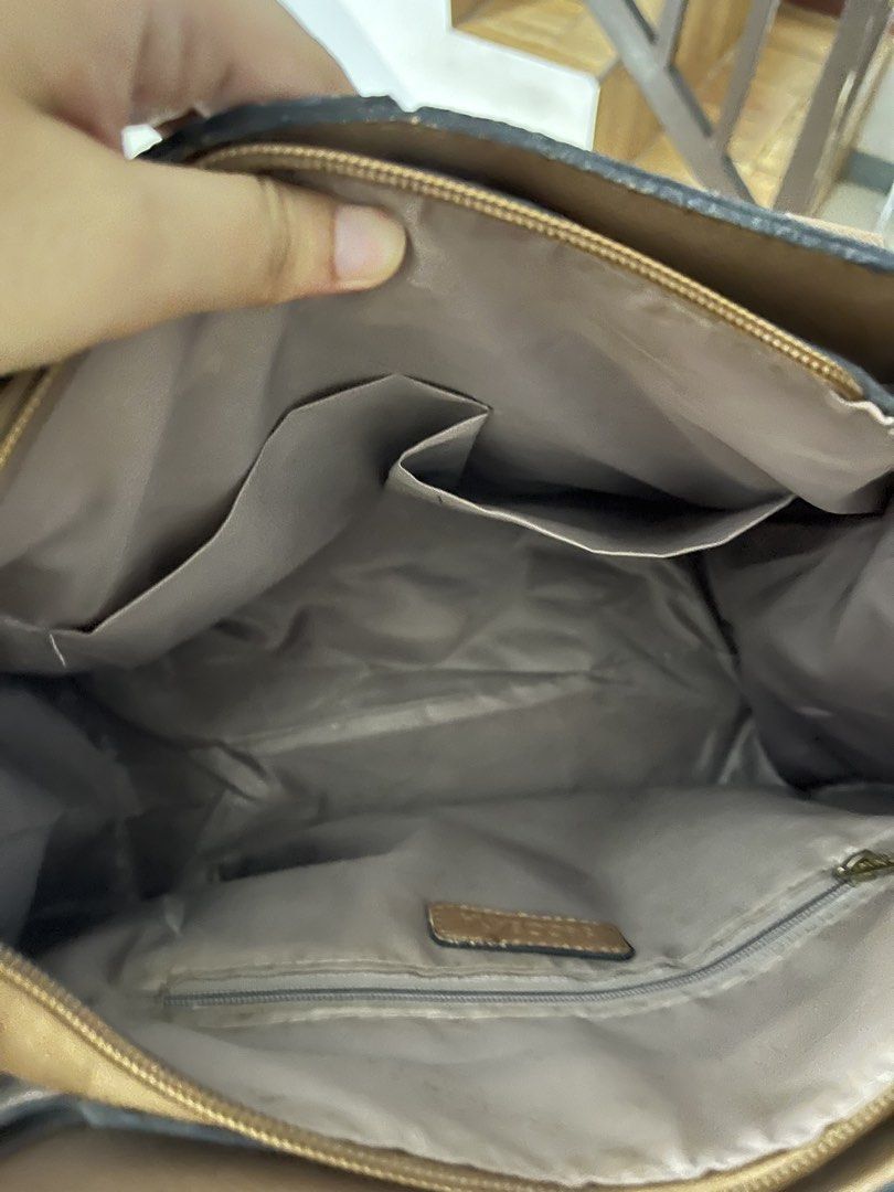 SC Bag with Dual Tone Design (Category: Luxury Bags & Wallets) located in Calamba. Submitted by calamba_declutter (Listing ID 1438009005, Image 2). Description: Secosana - Dual-tone handbag with "SC" logo pattern - Top handle design - Spacious interior with multiple compartments - Includes zippered pocket and additional pockets - Elegant beige and brown color combination - Gold-colored hardware.