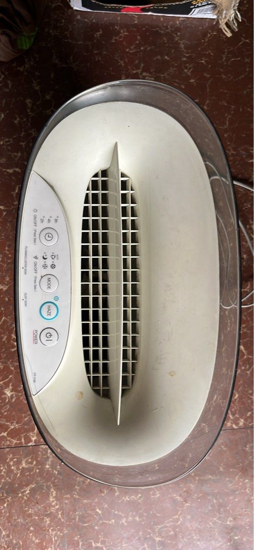 Sharp Air Purifier FP-F40 (Category: Air Purifiers & Dehumidifiers) located in Quezon City. Submitted by moonstar30 (Listing ID 1438005960, Image 1). Description: - Sharp FP-F40 Air Purifier - White body with clear water tank - Multiple settings: Mode, Haze, Timer - Control Panel: Power, Timer, Mode, Haze buttons - Sleek and modern design - Ideal for home use.