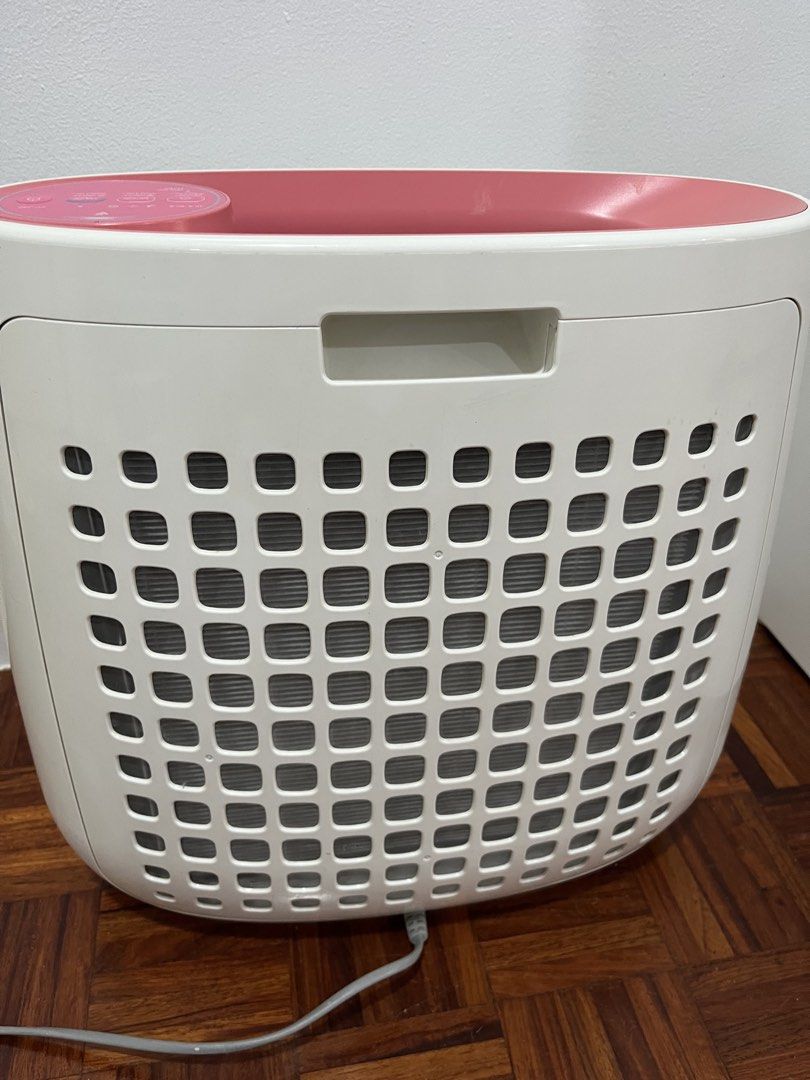 Sharp Air Purifier (pink) (Category: Air Purifiers & Dehumidifiers) located in Quezon City. Submitted by selling.thingzzz (Listing ID 1437976906, Image 3). Description: - Sharp FP-J30E-P Air Purifier - Color: White body with pink accents - Features: - Haze Mode - Timer Settings - Replaceable Filter - Includes Power Cord.